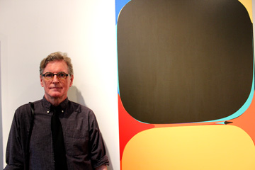 The artist with one of his paintings at Galerie Camille