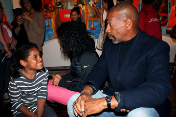 Tyree Guyton with a young fan